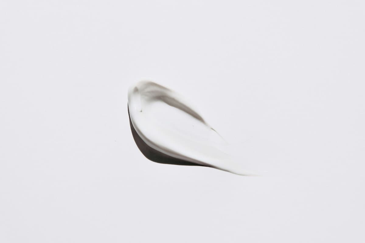 Minimalist skincare cream tube on clean background