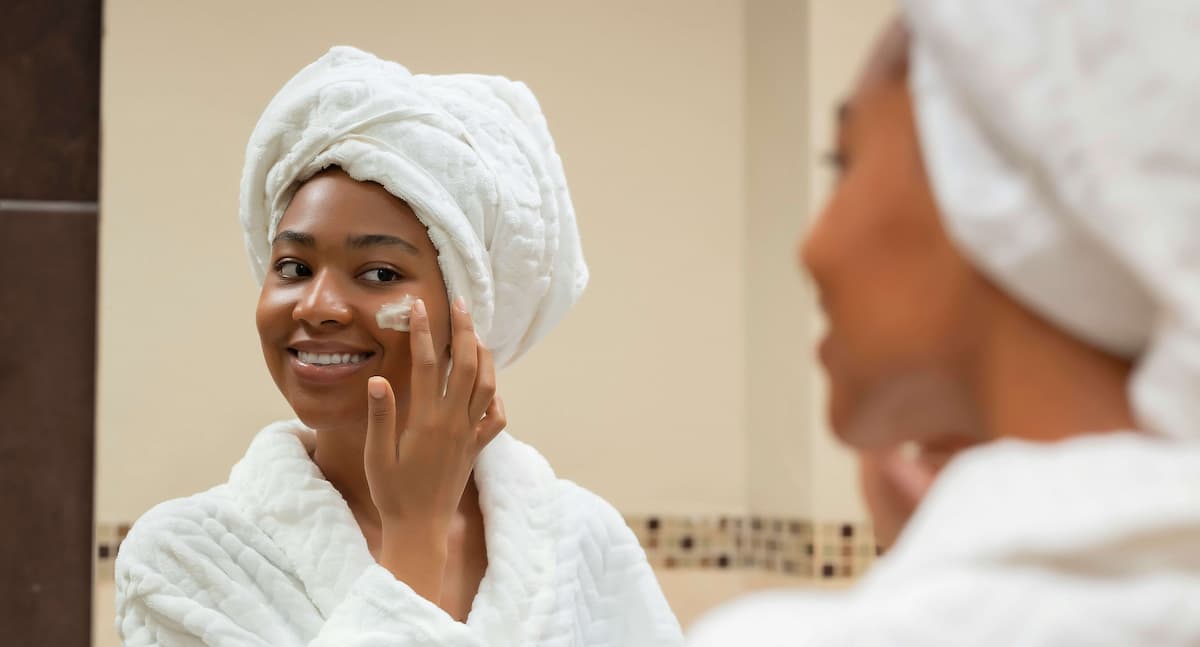 Skincare routine products lined up on bathroom counter